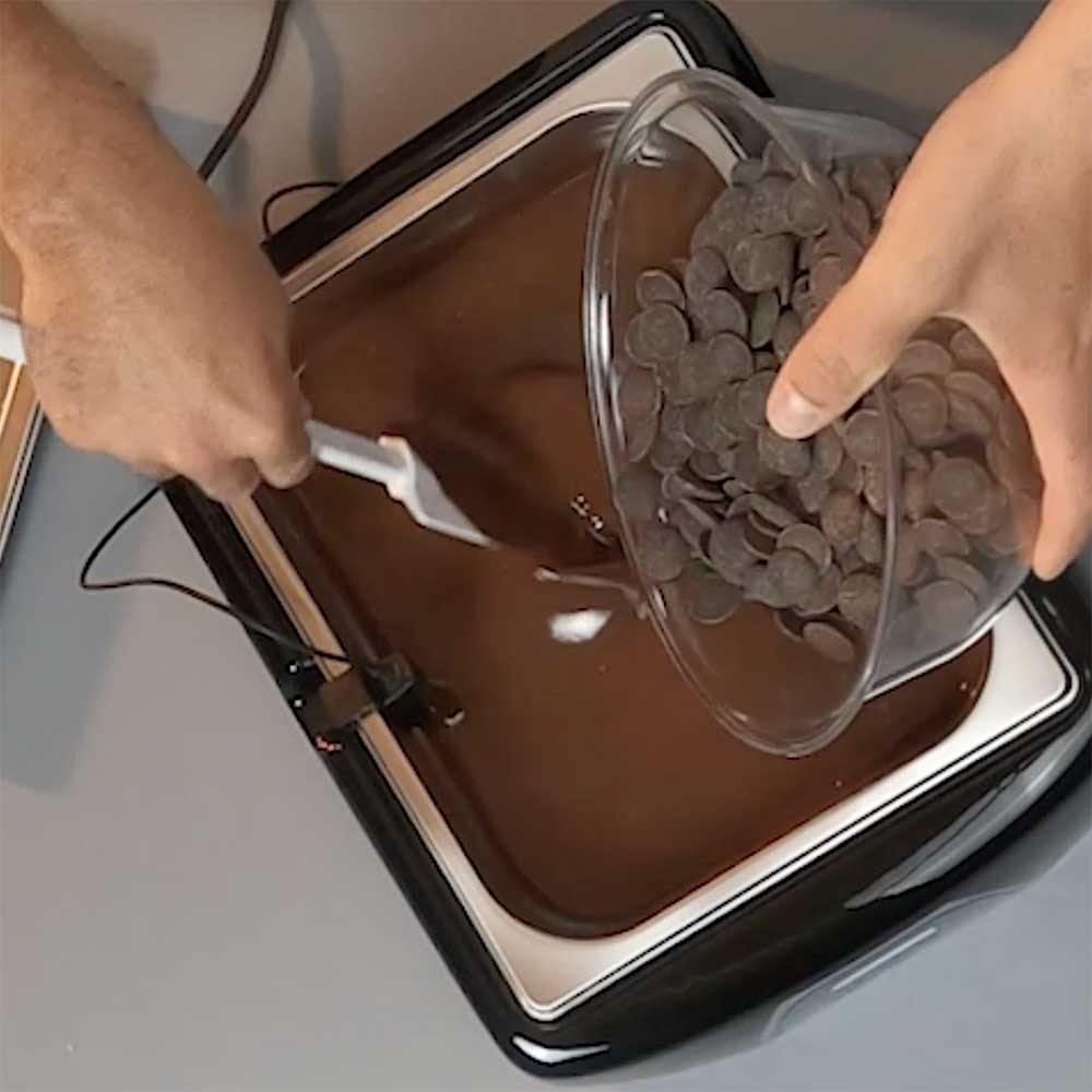 Professional chocolate melter melting couverture chocolate for artisan and commercial production